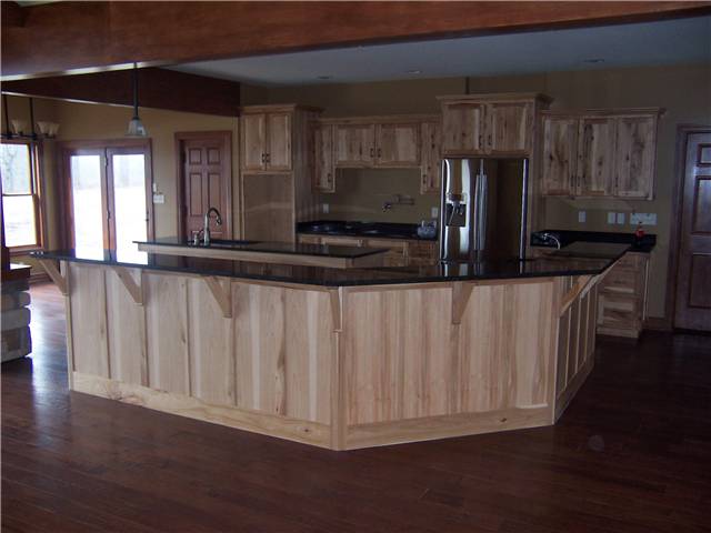 Rustic Hickory cabinets - Island with raised bar - Flat panel doors and side panels - Standard overlay style - Granite countertops